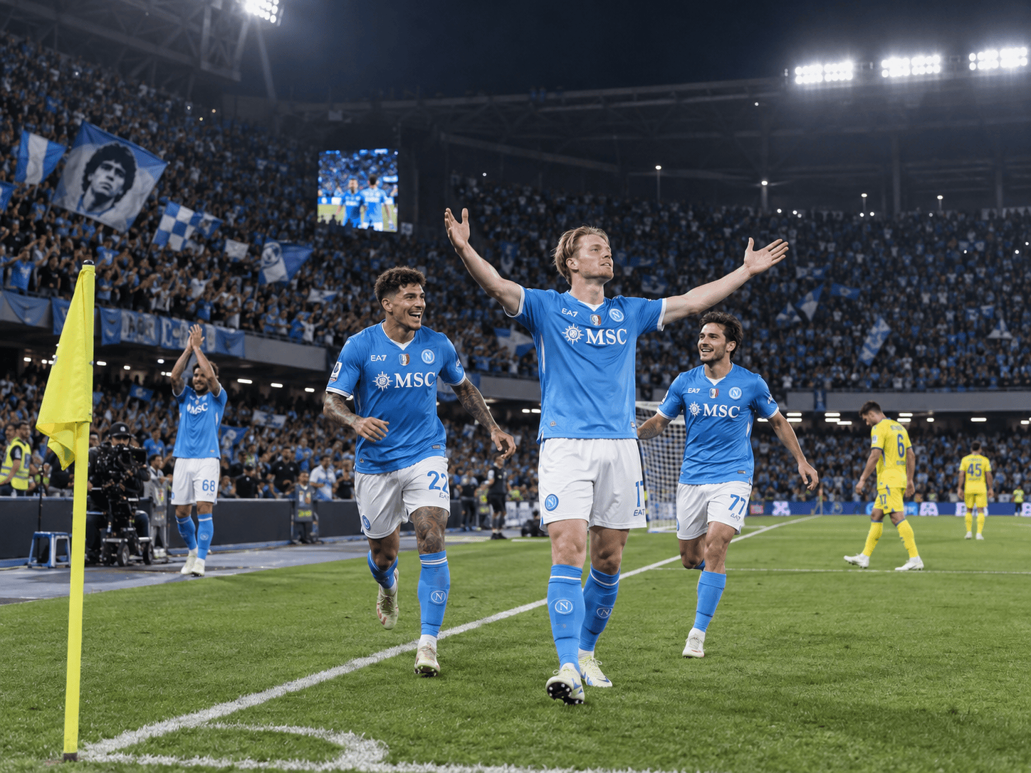 Giocatori del Napoli festeggiano sotto i riflettori dello stadio Diego Armando Maradona