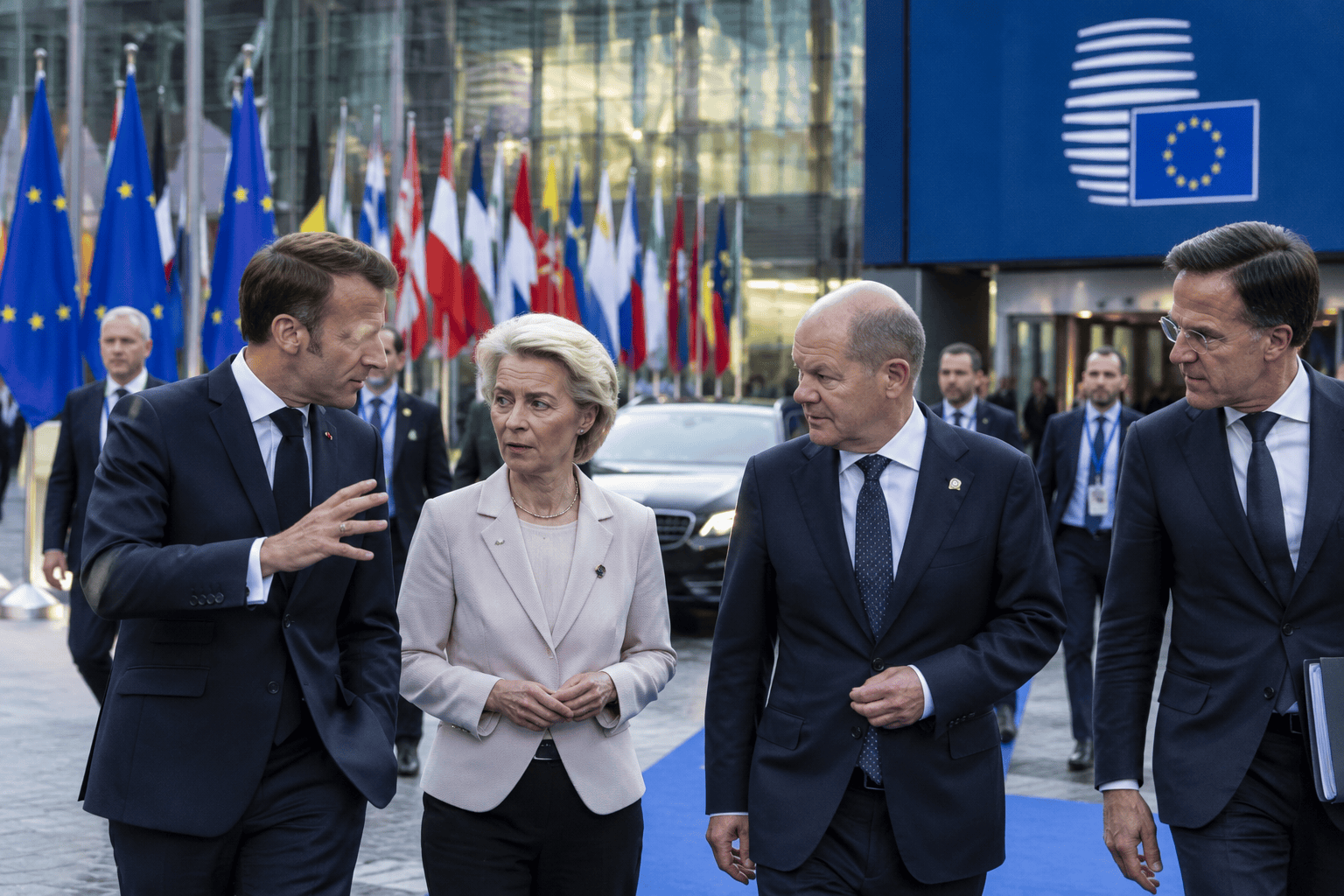 Vertice europeo tra bandiere dell'Unione europea e confronto diplomatico